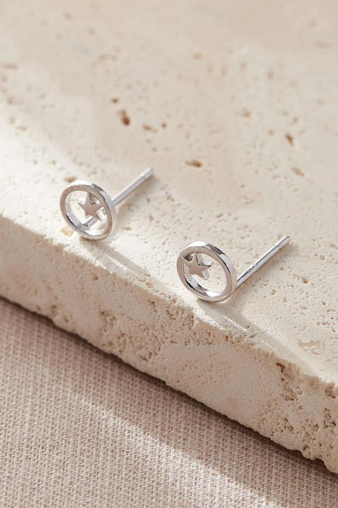 close up of the silver circle and star stud earrings