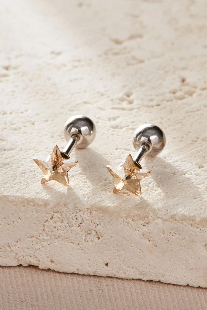 close up of the champage coloured star studs