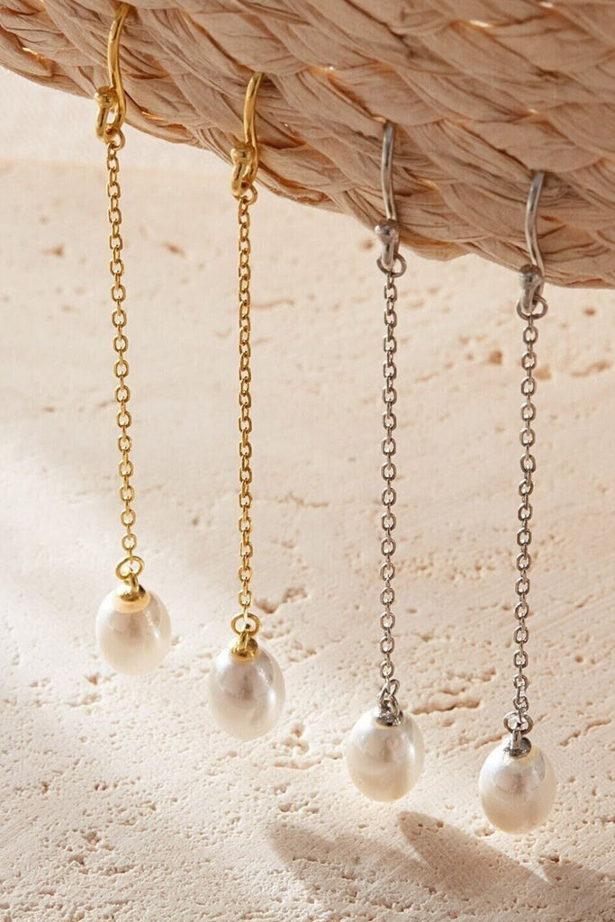 close up of both silver and gold options showing the dangle style of these faux pearl earrings