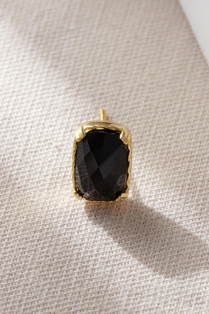 close up of the black and gold statement stud earrings