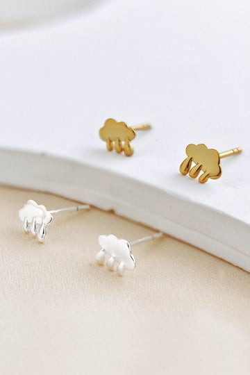 small stud earrings in silver and gold shaped like rain clouds, each cloud has three drops of rain