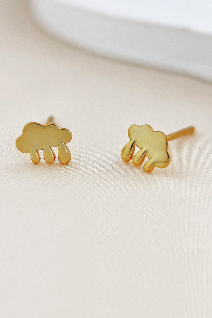 close up of the gold plated silver rain cloud stud earrings
