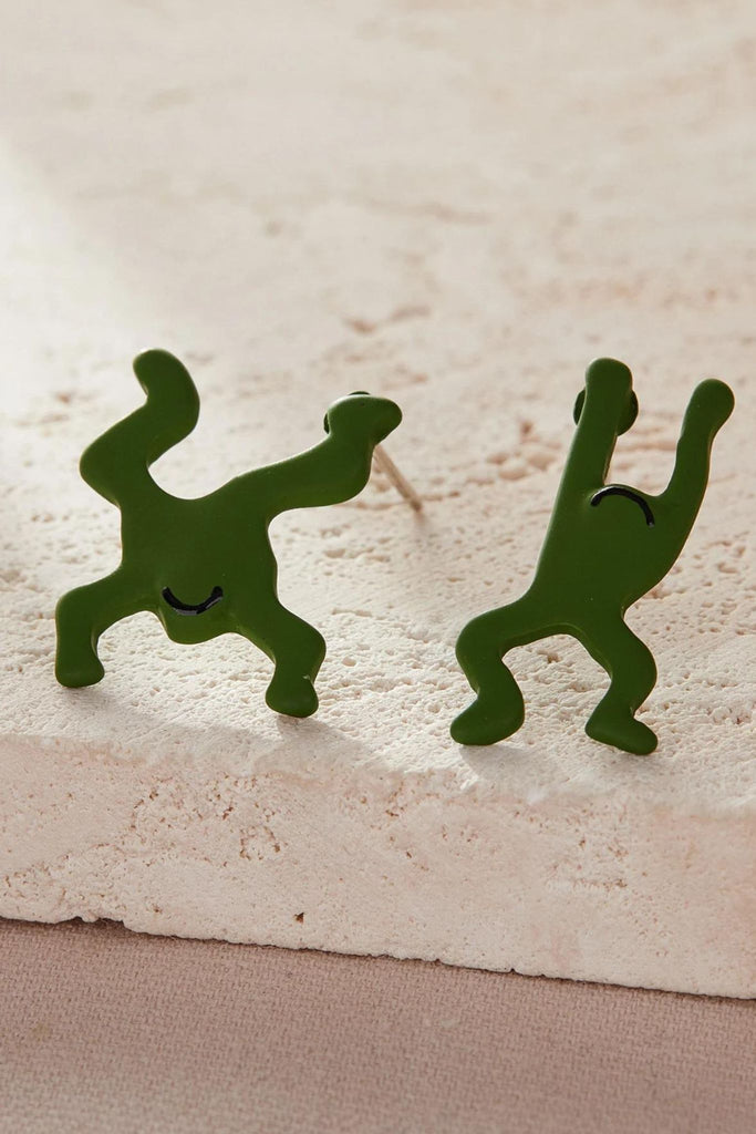 close up of the green leaping frog earrings