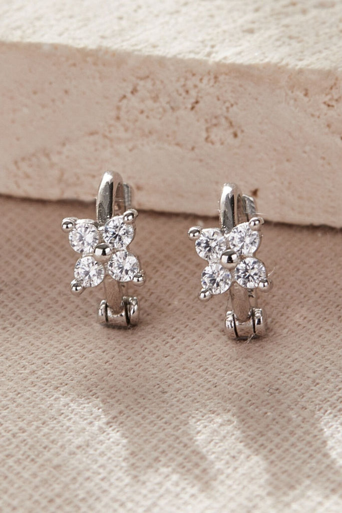 close up of the sterling silver cz floral cartilage hoops