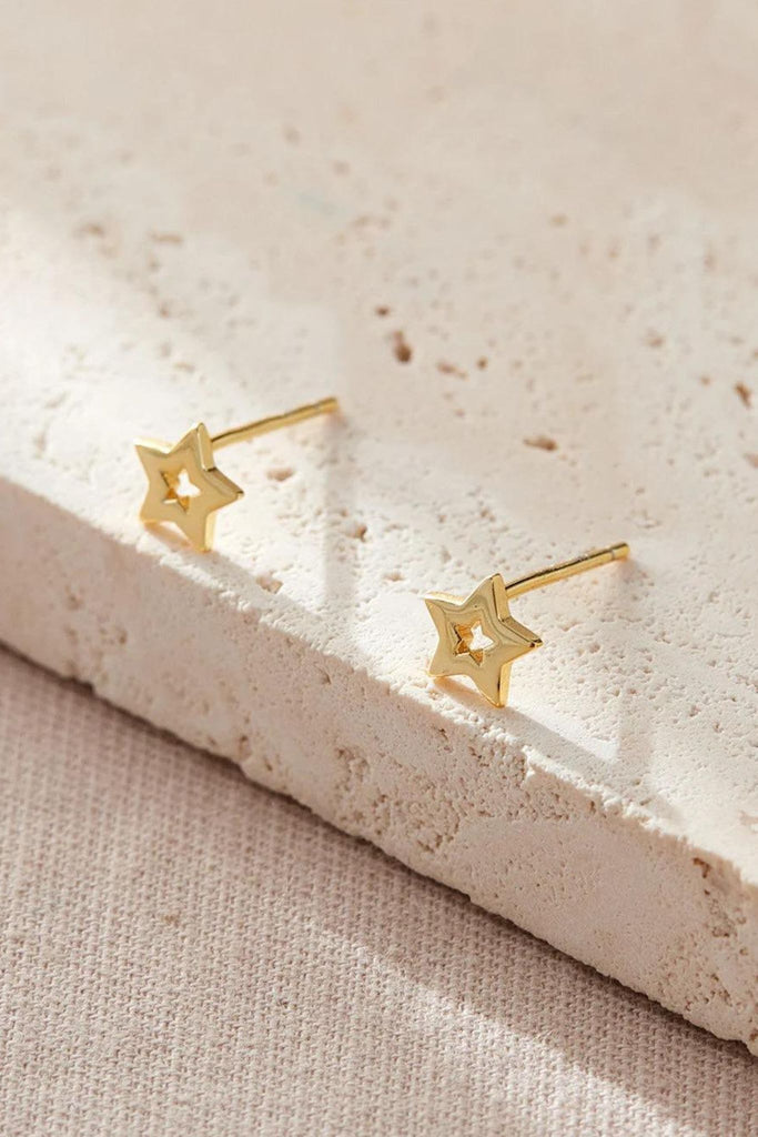 close up of the gold plated silver openwork star studs
