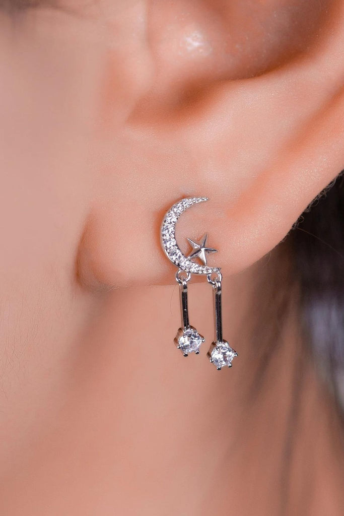 model wearing the silver coloured star moon stud, showing how it looks when worn