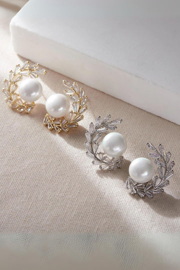 large pearl beads studs surrounded by crystal olive leaf wreaths, these earrings are large statement studs