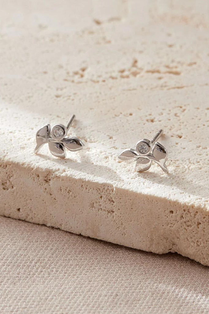 close up of the silver olive leaf stud earrings