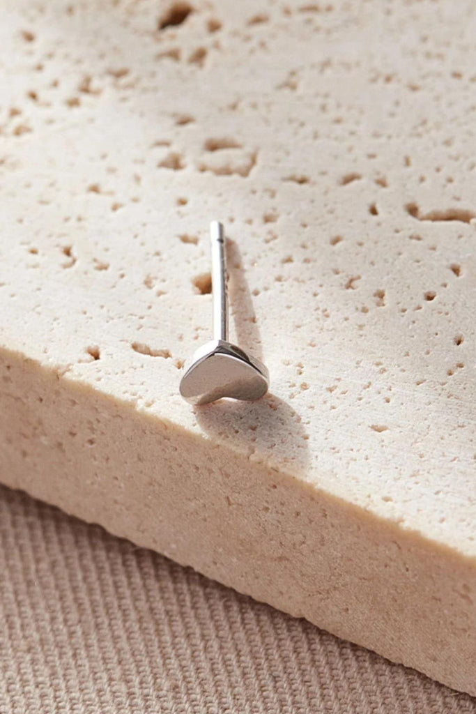 close up of the dainty silver star stud earrings