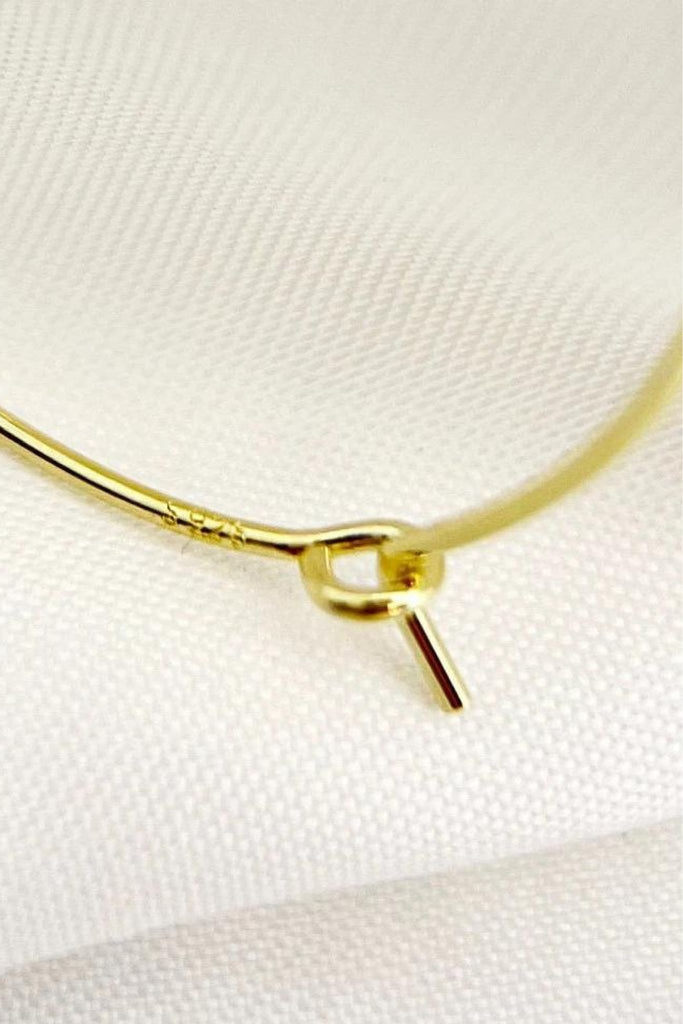 close up of the latchback closure and of the s925 stamp on the earrings