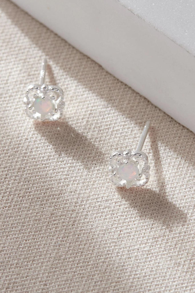 close up of the silver coloured opal floral studs