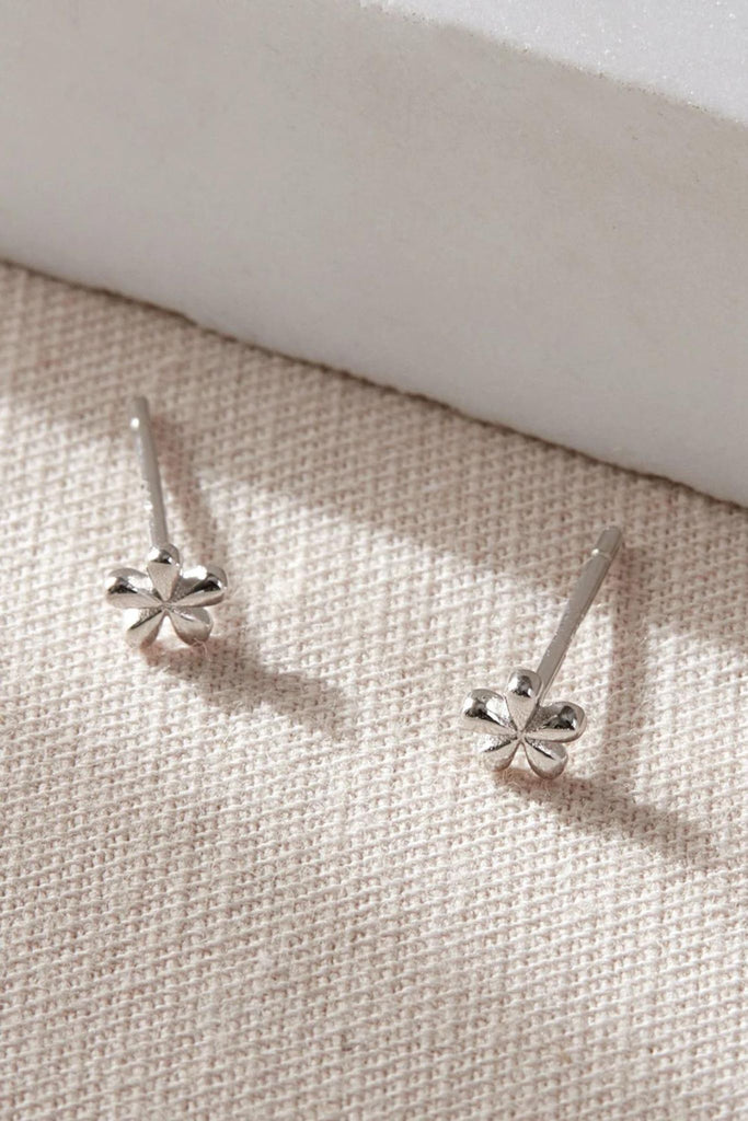close up of the silver coloured S925 dainty floral stud earrings