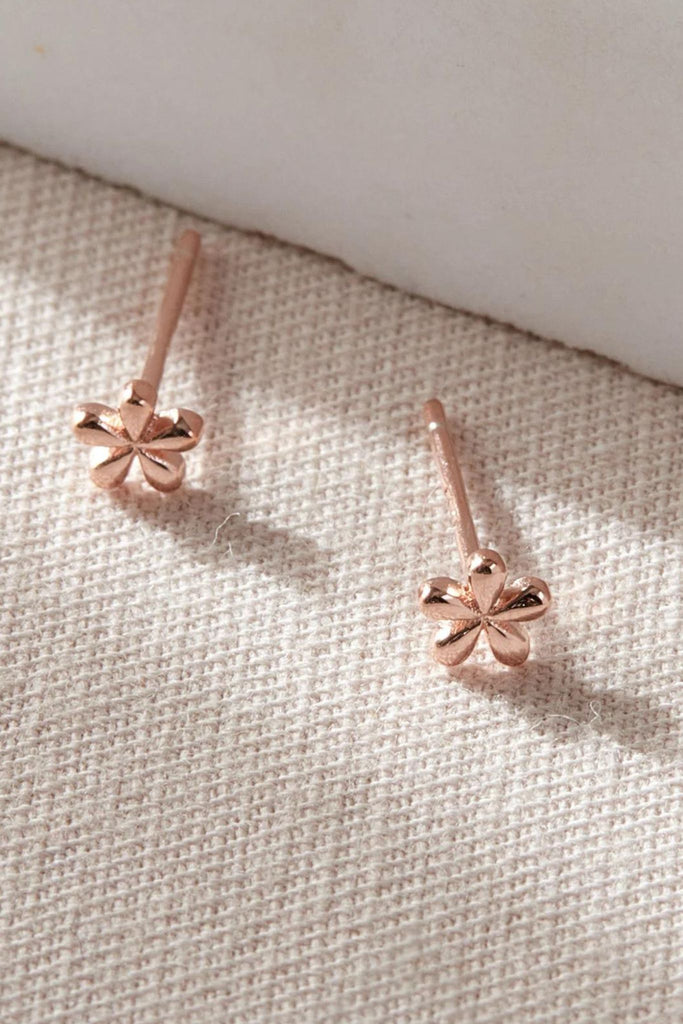 close up of the rose gold coloured S925 dainty floral stud earrings