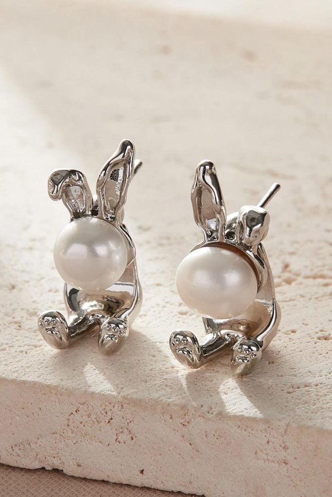 close up of the silver pearl rabbit studs