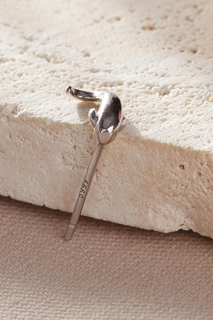 close up of the s999 stamp on the pins of the earrings