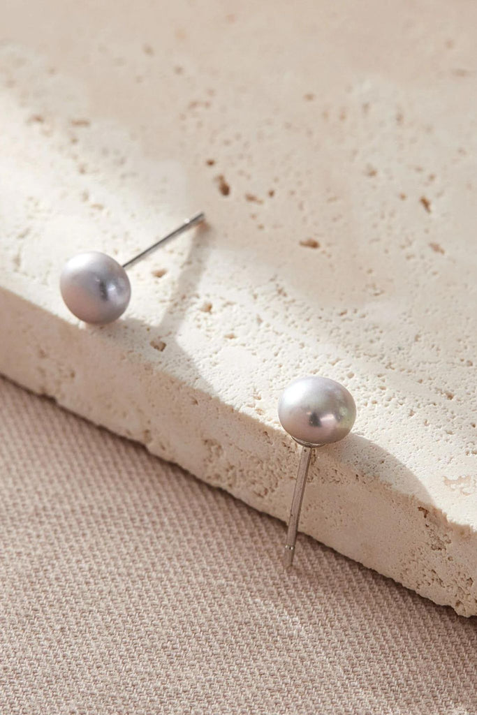 close up of the silver pearl studs