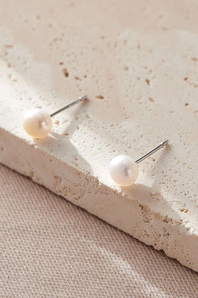 close up of the white pearl studs
