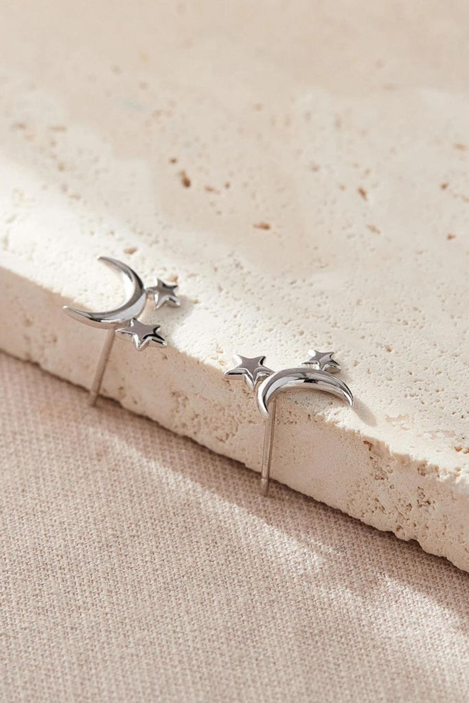 showing the crescent moon and star earrings from above