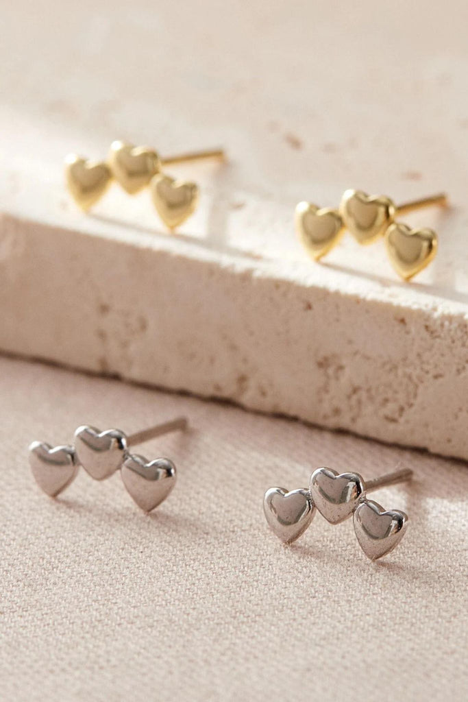 silver and gold stud earrings, each stud has three adjoining love hearts