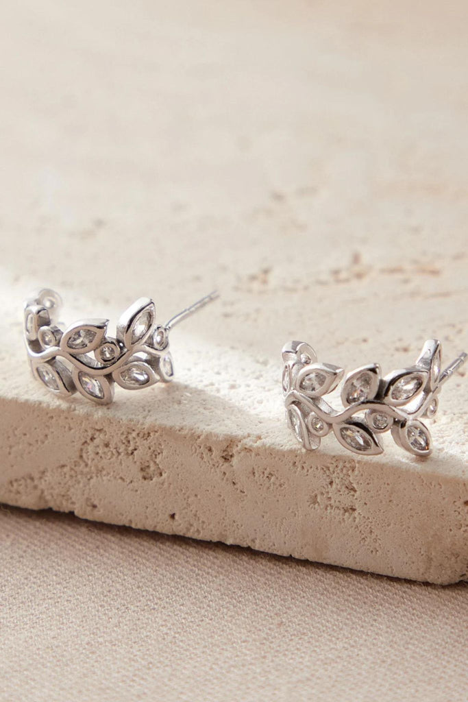 close up of the silver sparkly olive leaf earrings