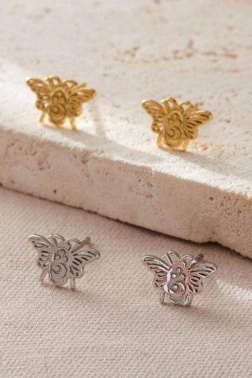 silver and gold bee stud earrings, the bees have a crescent moon and four dainty stars on them, giving them a celestial look