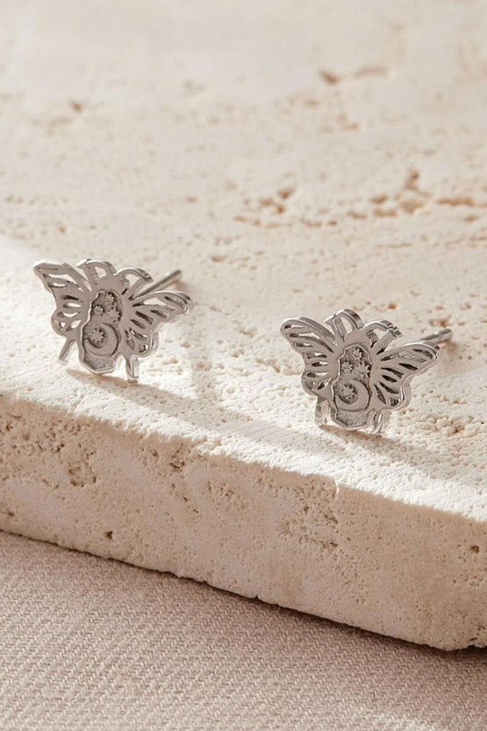 close up of the silver celestial bee earrings