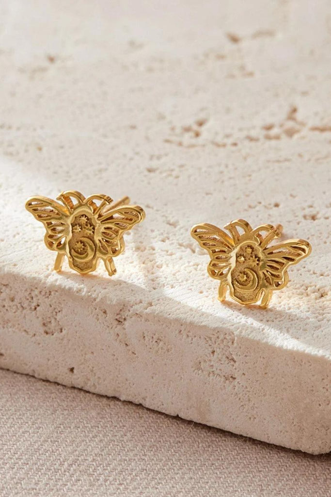 close up of the gold plated silver celestial bee earrings