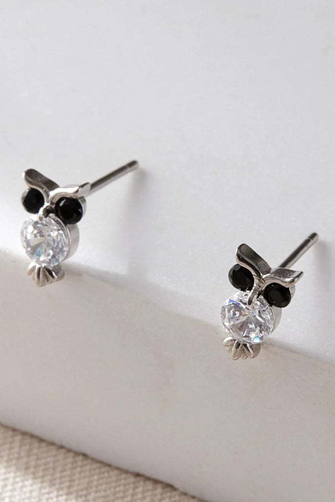 close up of the silver owl stud earrings