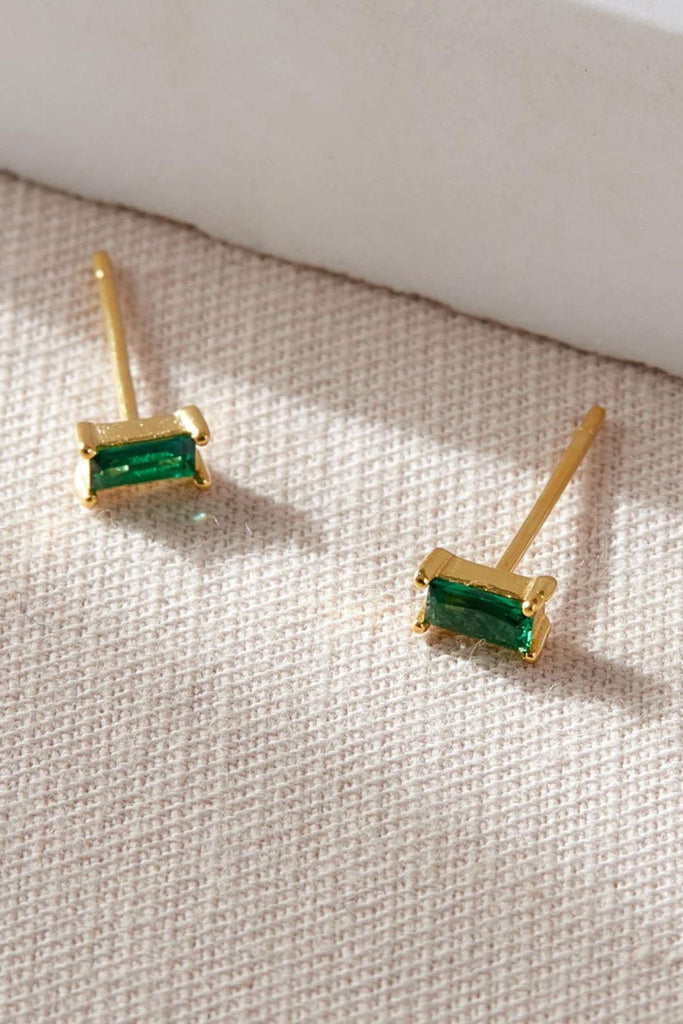 close up of the gold and green sparkly studs