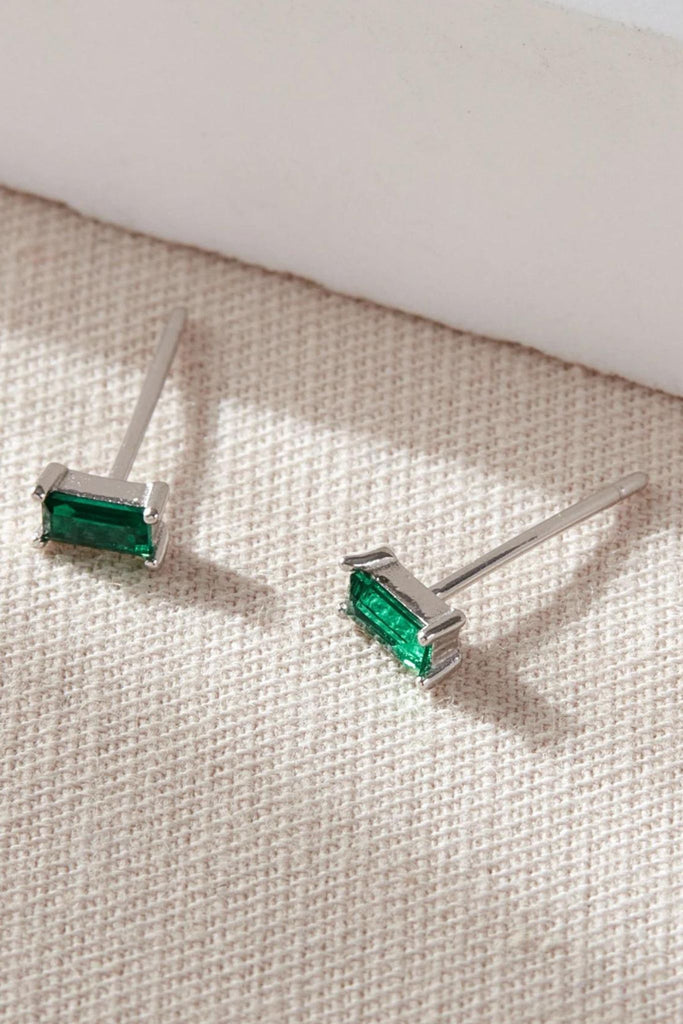 close up of the silver and green sparkly studs