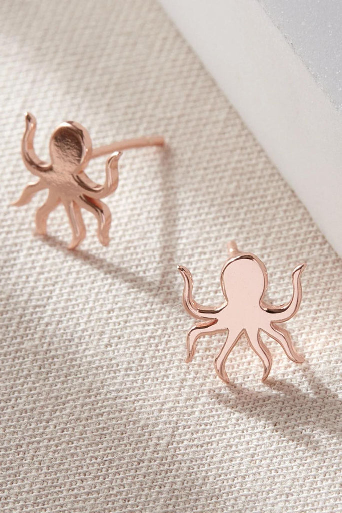 close up of the rose gold octopus stud earrings