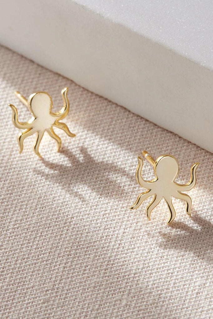 close up of the gold octopus stud earrings