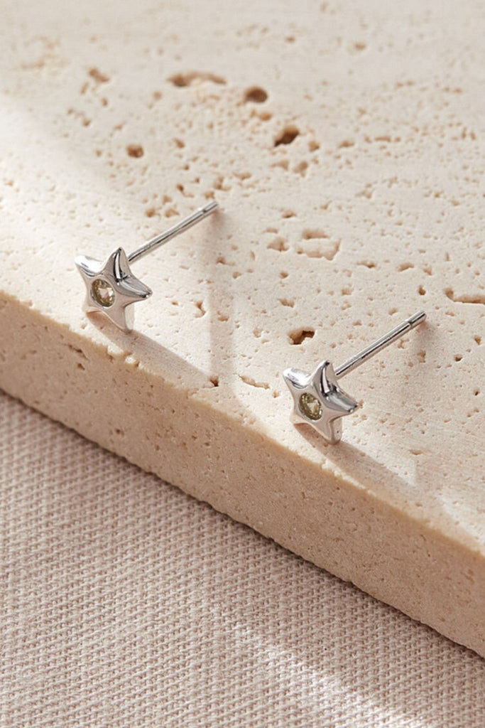 close up of the yellow, november star stud earrings