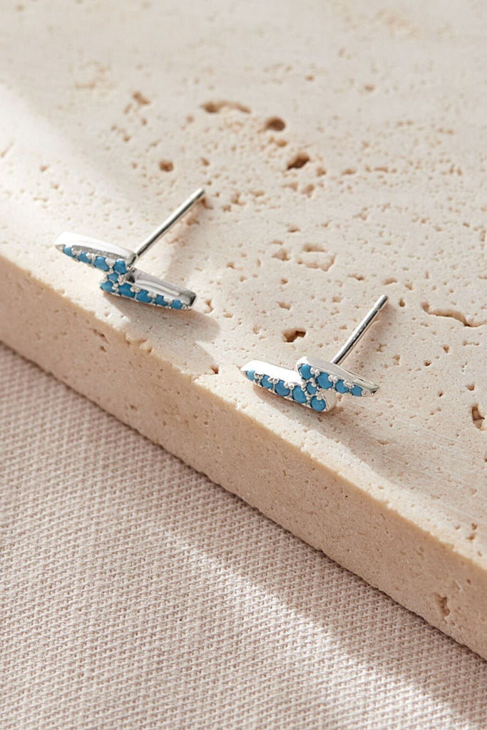 close up of the turquoise lighting bolt studs