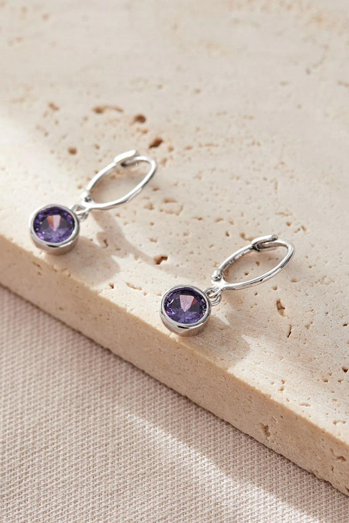 close up of the purple birthstone earrings