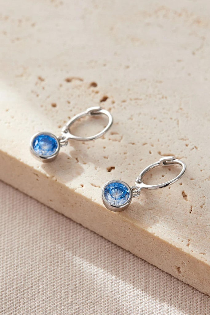 close up of the blue birthstone earrings