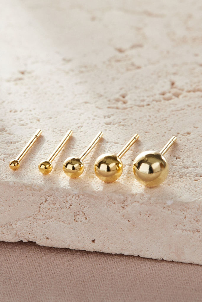 close up of the gold ball studs