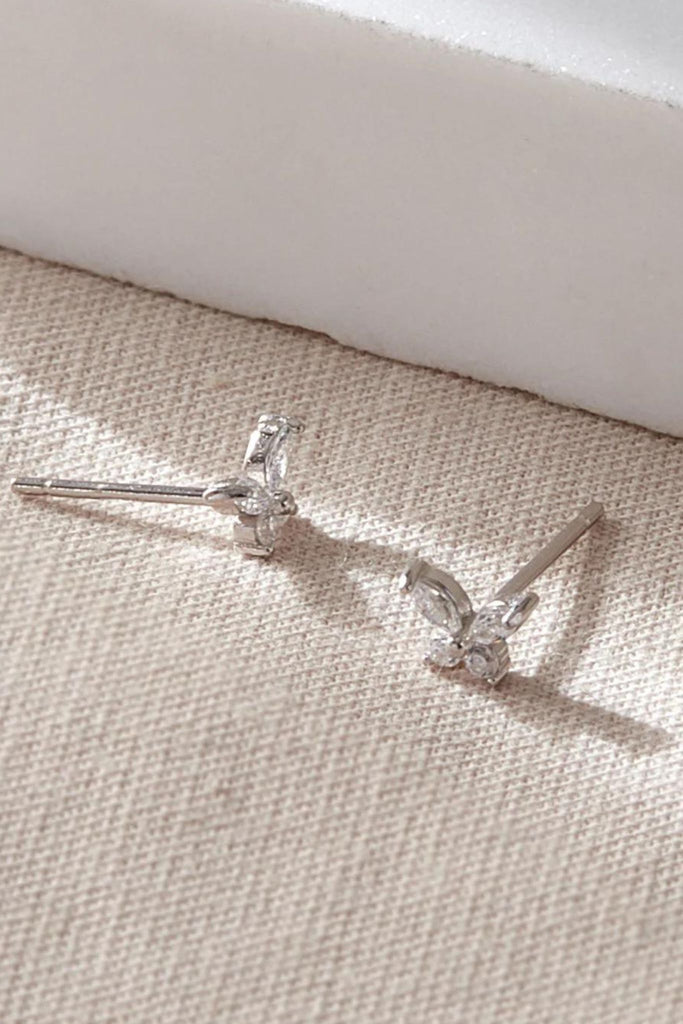 close up of the dainty silver butterfly stud earrings