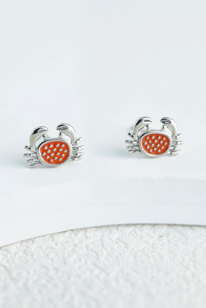 close up of the silver crab stud earrings