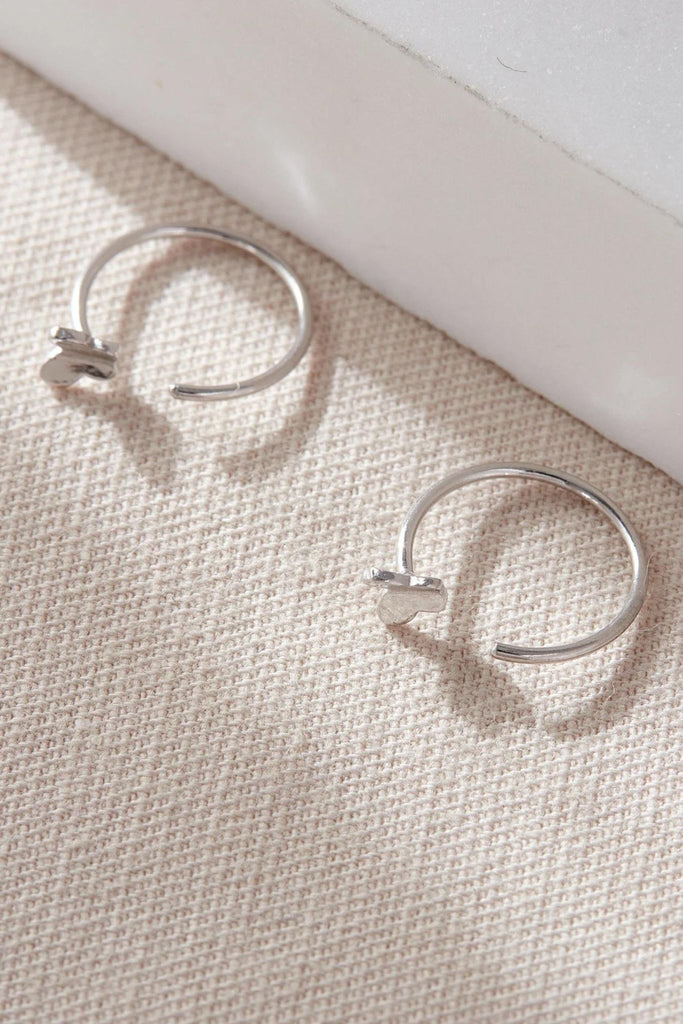 close up of the butterfly hook earrings, showing the dainty size of the butteflies