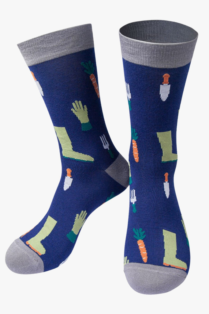 navy blue, grey bamboo socks featuring garden tools, boots, gloves and carrots