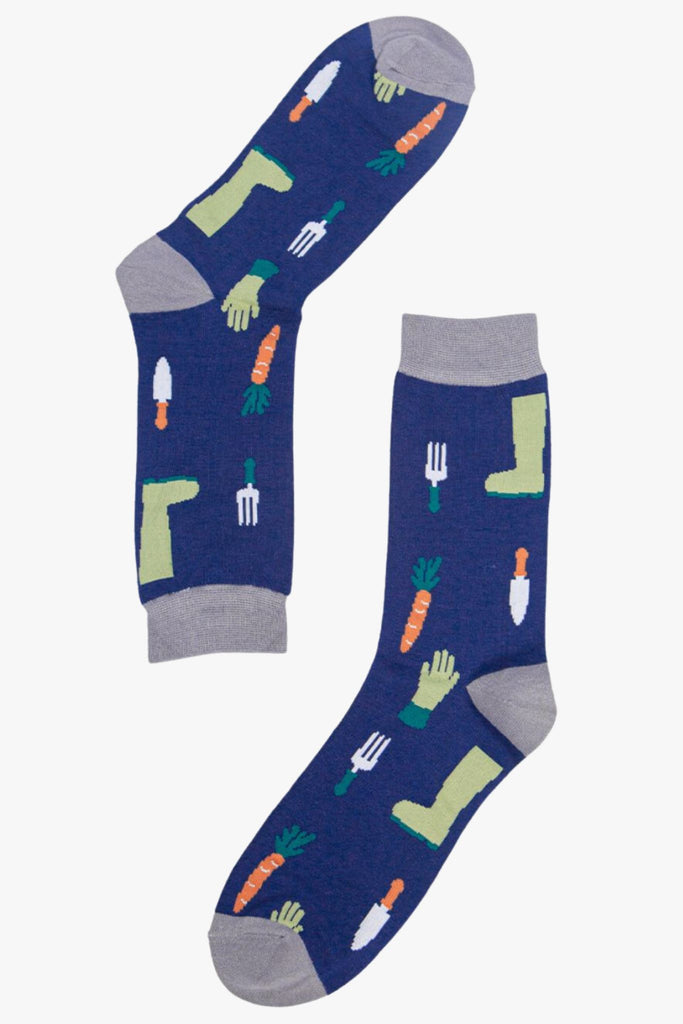 blue dress socks with carrots, gloves, boots and garden tools