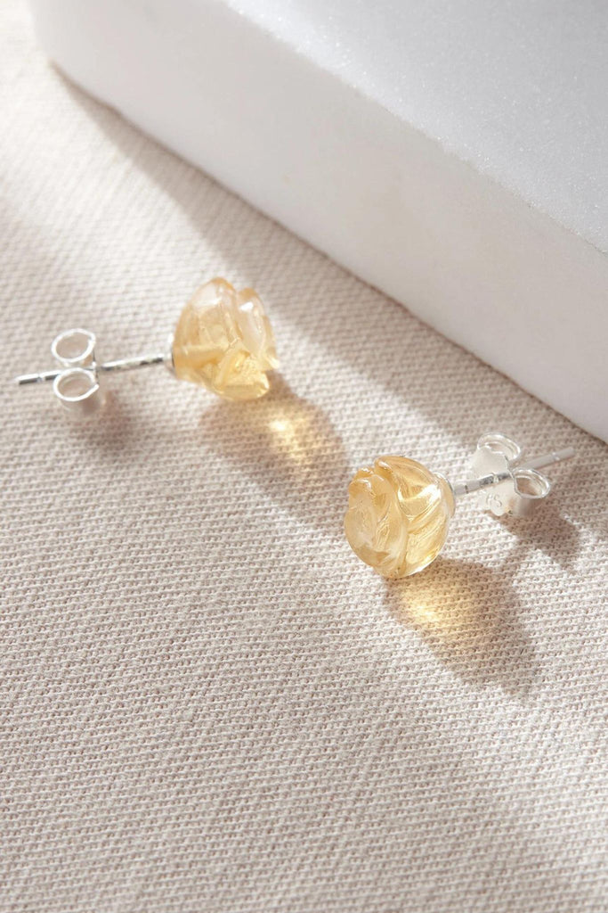 close up of the yellow citrine rose stud earrings