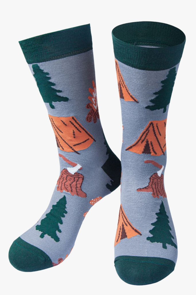 grey, green camping socks featuring tents, trees and tree stumps