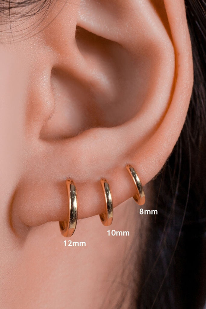 model wearing all three sizes of gold plated s925 silver hoops as stackable earrings, showing the size difference between all three sizes