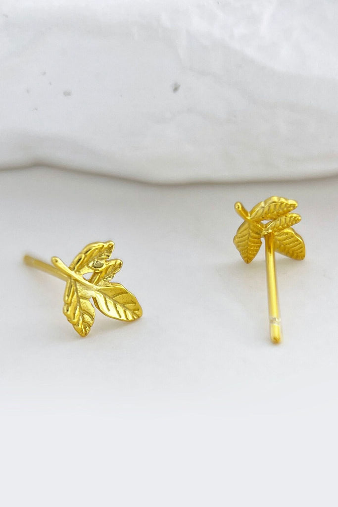 close up of the gold plated sterling silver leaves stud earrings