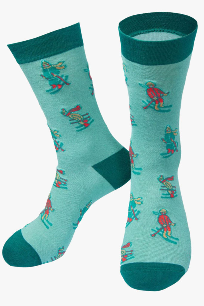 green bamboo socks with cartoon skiers on them