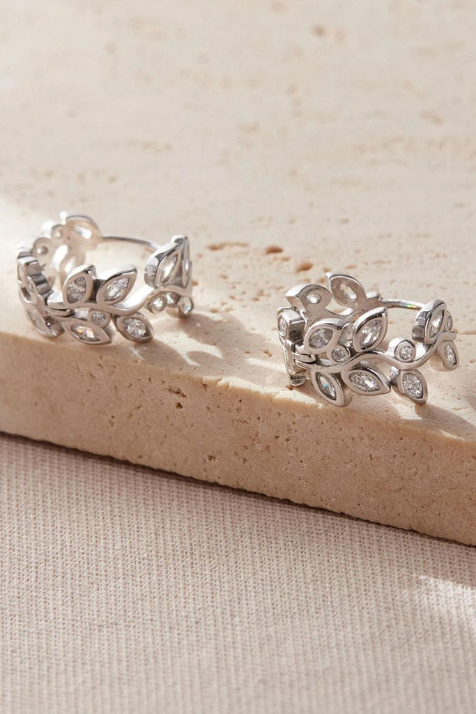 close up of the silver sparkly olive leaf hoops