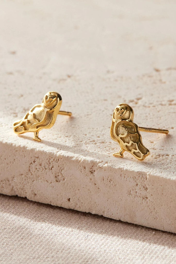 a pair of gold plated silver barn owl stud earrings
