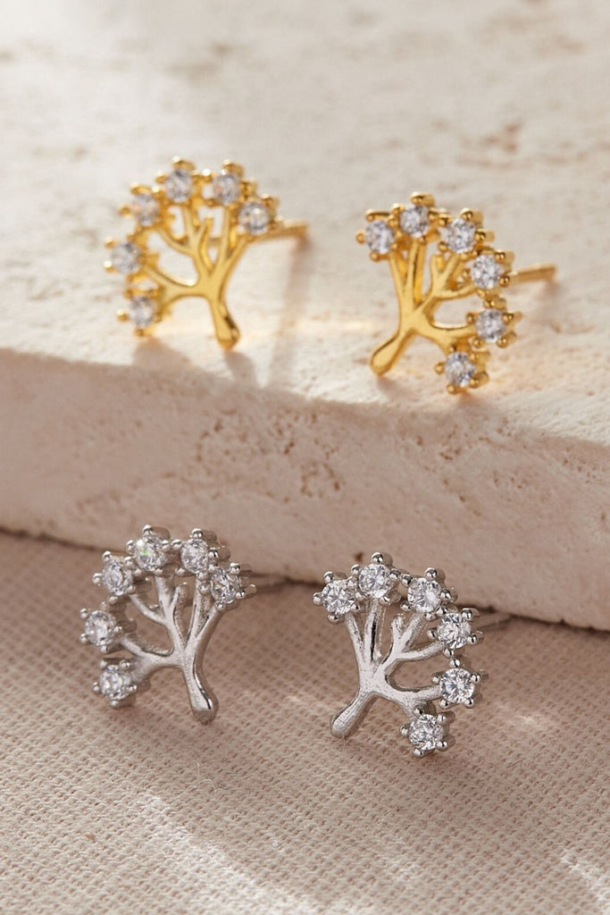 silver and gold tree of life stud earrings, the trees have six branches and there are small round white cz studs on the end of each one, the earrings are available in silver and gold